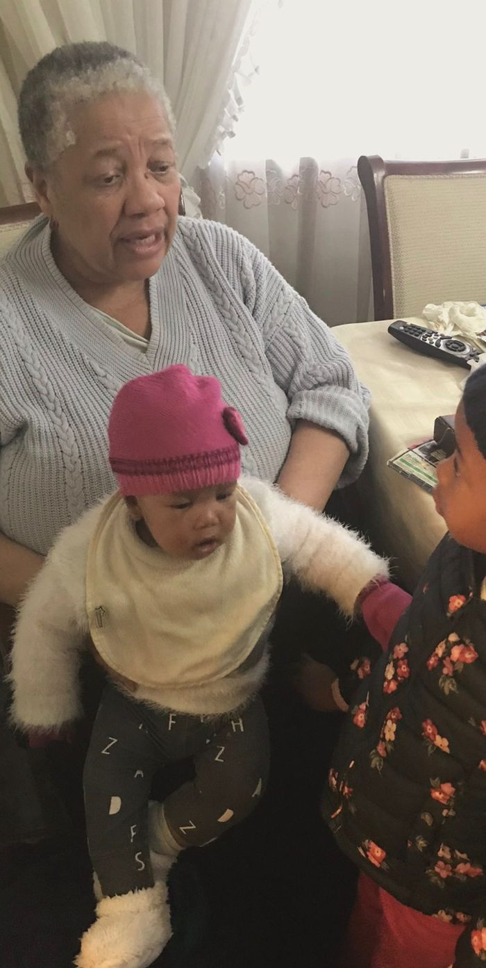 Gogo Margaret holding a baby