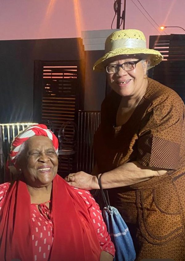 Margaret with her sister at a celebration