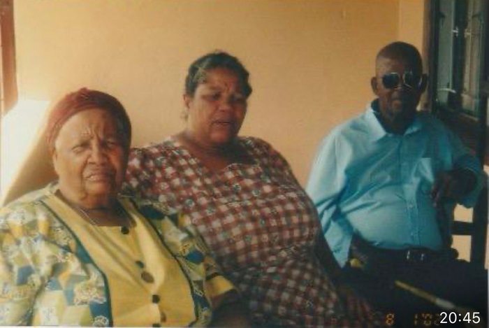 Margaret seated with her parents