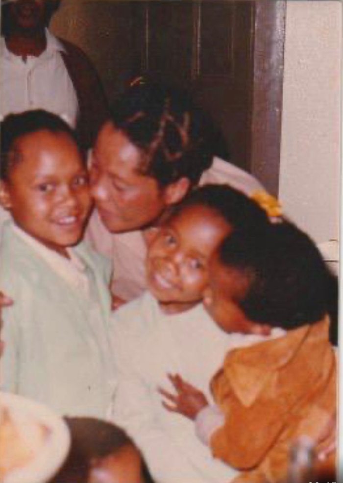 Margaret holding her children close