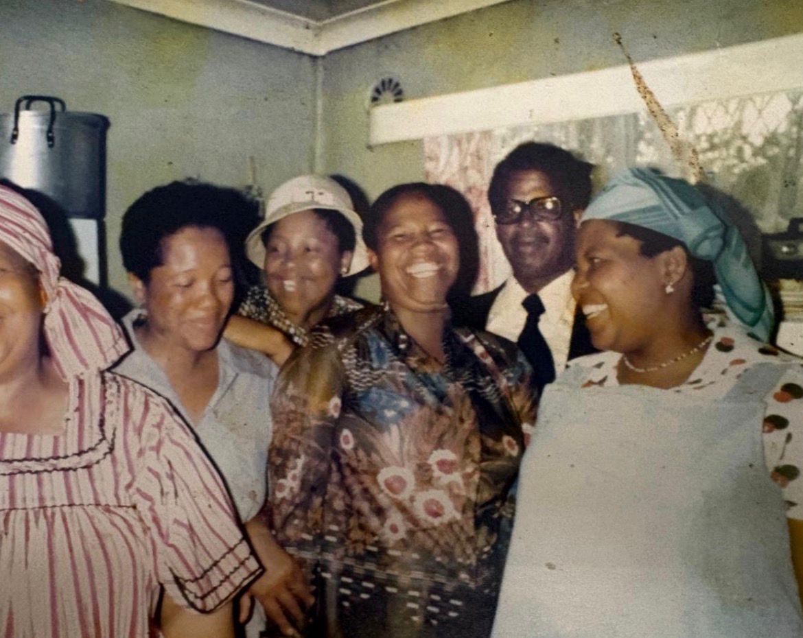 Margaret with her sisters and father, a family gathering