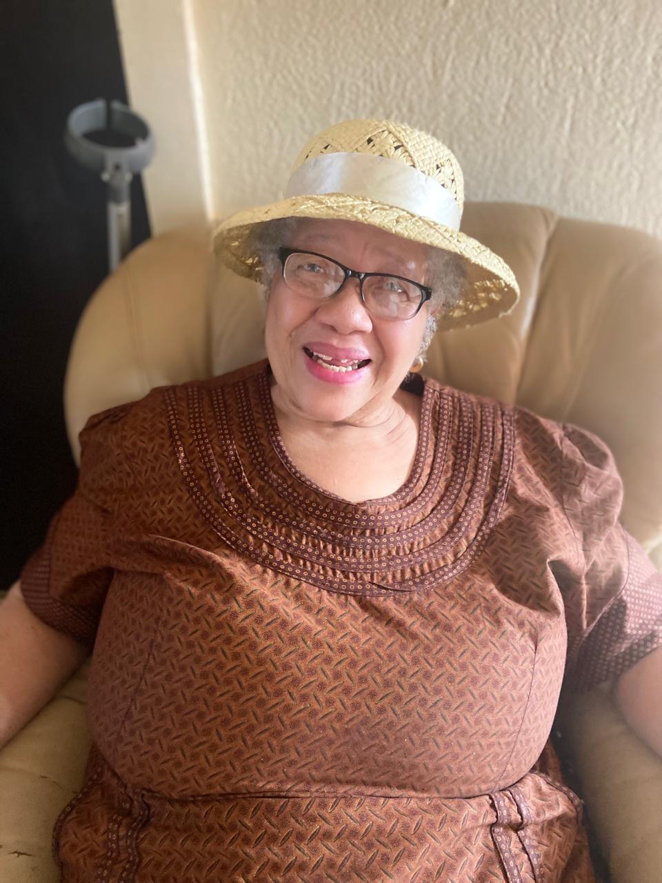 Margaret in her straw hat, full of joy
